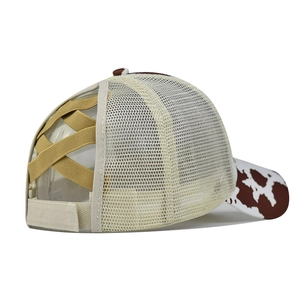 Detail of cow print brim and khaki criss-cross elastic bands for ponytail baseball cap