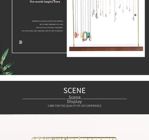 Detail of walnut wood base and golden metal tiered frame for creative necklace display stand
