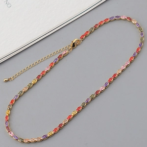 Detail view of colorful marquise zirconia stones on a gold-plated link necklace