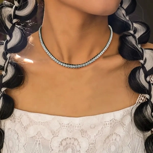 Close-up of a silver tennis necklace featuring square-cut sparkling zircon stones