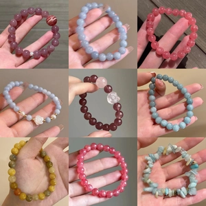 Natural crystal stone bead bracelet with strawberry quartz and aquamarine in grid view