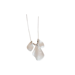 Elegant silver necklace featuring three white brushed petal pendants with a pearl luster finish