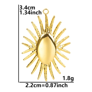 Detail view of gold sun pendant with measurements 3.4cm height and 2.2cm width