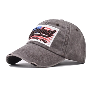 Detail view of washed cotton baseball cap with American flag and Original embroidery