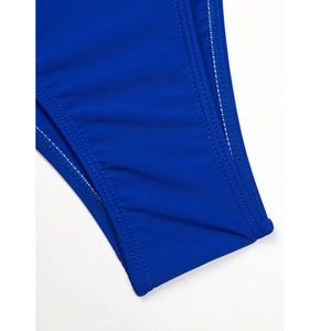 Macro detail of royal blue swimsuit fabric featuring durable double-needle stitching