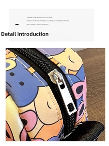 Close-up of durable black zipper and silver metal puller on a colorful cartoon crossbody bag