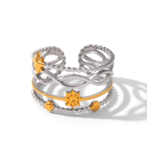 Macro detail of multi-layer celestial ring with silver beads and golden sun star charms