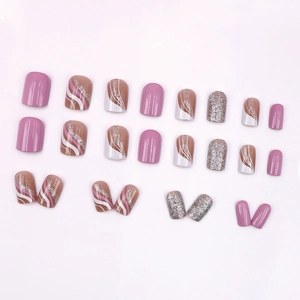 Short square press-on nails set in dusty pink and silver glitter with wavy patterns
