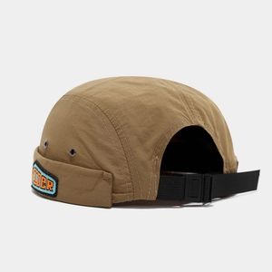 Detail of tan ripstop docker hat featuring Rider patch and metallic ventilation eyelets