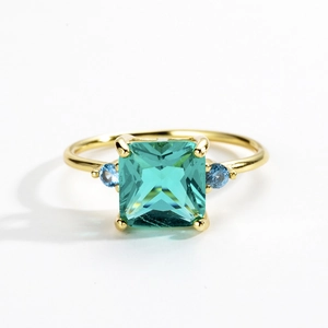 S925 sterling silver gold ring featuring a square green gemstone and blue side stones