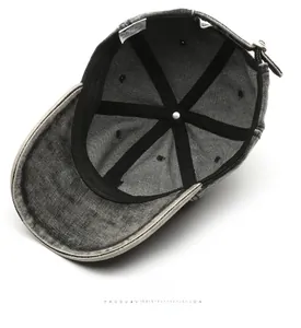 Internal view of charcoal grey denim baseball cap showing 100% cotton label and stitching