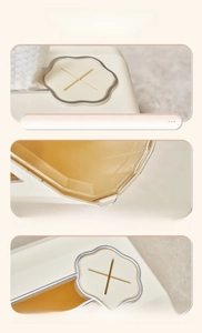 Detail of cream face towel box showing silver trim and soft silicone cross opening