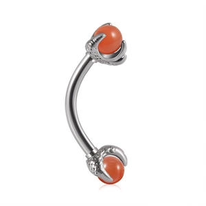 Macro detail of silver curved barbell with dragon claw holding an orange bead