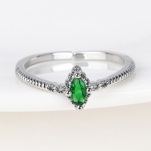 Macro shot of marquise-cut green zircon on vintage twisted silver adjustable ring