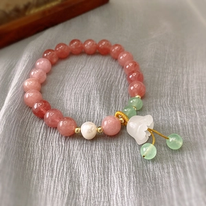 Pink strawberry quartz bracelet with white pearls and flower charm on grey silk