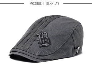 Detail view of cotton ivy cap with black stripes, gothic B embroidery and metal buckle