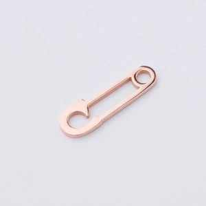 Minimalist rose gold titanium steel safety pin pendant with a polished metallic finish