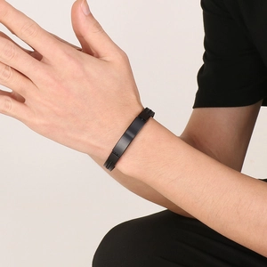 Minimalist black stainless steel curved plate leather bracelet for men on wrist