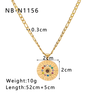 Close-up of 18k gold plated zodiac pendant with zircon stones on a Figaro chain