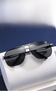 Detail of silver metal frame aviator sunglasses with polarized grey lenses for men