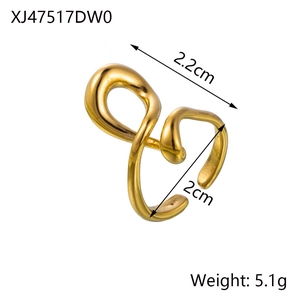 Macro detail of golden irregular spiral titanium steel ring showing adjustable open design