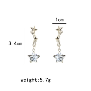 Detail view of silver star tassel earrings with zircon inlay and size dimensions