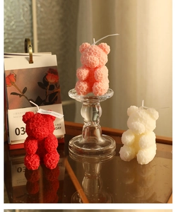 Detail of rose texture bear candles in red, pink, and white with handmade labels