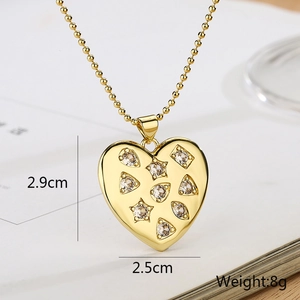 Macro shot of gold heart pendant with zircon details and size dimensions markings