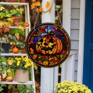 Halloween pumpkin stained glass style hanging ornament with metal chain on porch
