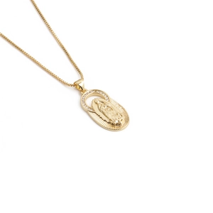Detail of a 18K gold plated Virgin Mary pendant with sparkling crystals and box chain
