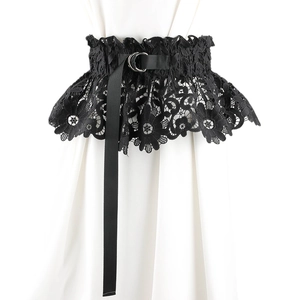 Detailed view of black lace corset belt with floral patterns and metallic D-ring buckle