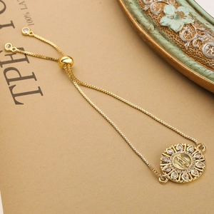Gold adjustable bracelet with Virgin Mary medallion and sparkling cubic zirconia stones