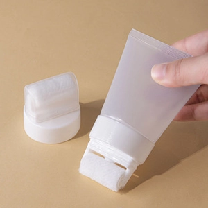 Macro shot of refillable tube with roller applicator for lotion and skincare products