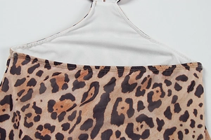 Close-up of leopard print fabric with white lining and high-quality double stitching