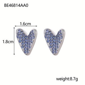 Detail view of heart-shaped earrings with blue rhinestones, size 1.6cm by 1.8cm