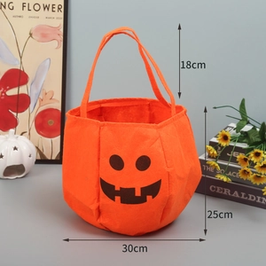 Detailed view of an orange pumpkin candy bag with dimensions 30cm width and 25cm height