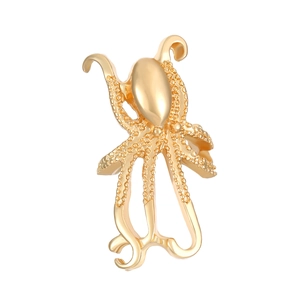 Close-up of golden octopus ear cuff showing intricate suction cup textures and details