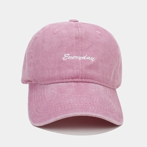 Close-up of EveryDay embroidery on a vintage washed pink cotton baseball cap