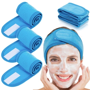 Set of 4 blue terry cloth spa headbands with velcro for makeup and skincare use