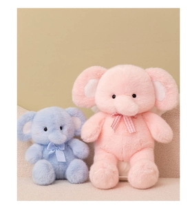 Detailed view of pink and blue plush elephant toys with decorative plaid bow ties