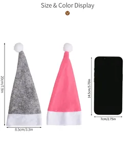 Größenvergleich der Weihnachts-Minimütze mit Maßangaben neben einem Mobiltelefon