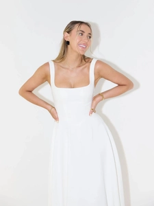 Detail of white square neck sleeveless maxi dress with fitted waist and flowing hemline