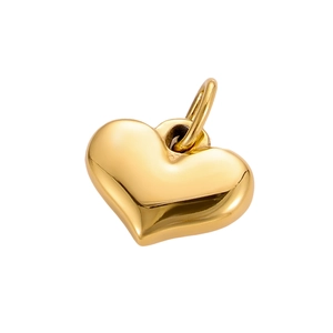 Detailed close-up of a polished gold heart-shaped metal pendant with shiny finish