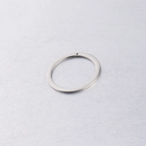 Close-up of a 30mm mirror polished stainless steel flat round pendant for DIY jewelry