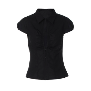 Detail view of black short-sleeve shirt with pleated bust texture and center cut-out