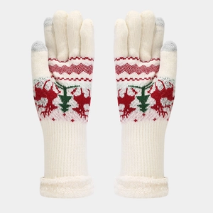 Detail of white Christmas knit gloves with reindeer pattern and plush cuffs