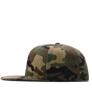 Macro side view of camouflage snapback flat brim cap showing durable cotton fabric texture