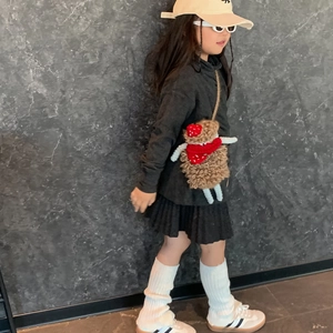 Kids funny handmade crochet lamb crossbody bag shown on a stylish young model