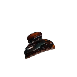 Elegant amber heart-shaped hair claw clip with glossy finish for thick hair
