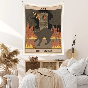Detail of bohemian black cat tarot tapestry hanging in a minimalist bedroom setting